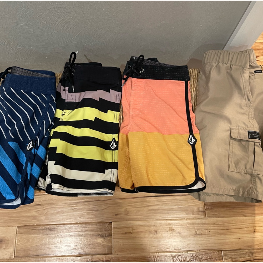 Four pairs of boys swim trunks all size 7. Sold together.